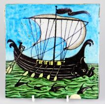 WILLIAM DE MORGAN; an Art Pottery tile painted with a galleon ship with six sailors with paddles