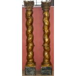 A large pair of 17th/18th century Italian gilded Solomonic columns with carved Corinthian capitals