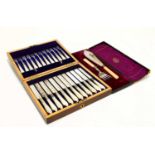 A mahogany cased twelve setting silver plated fruit set with mother of pearl handles and a cased set