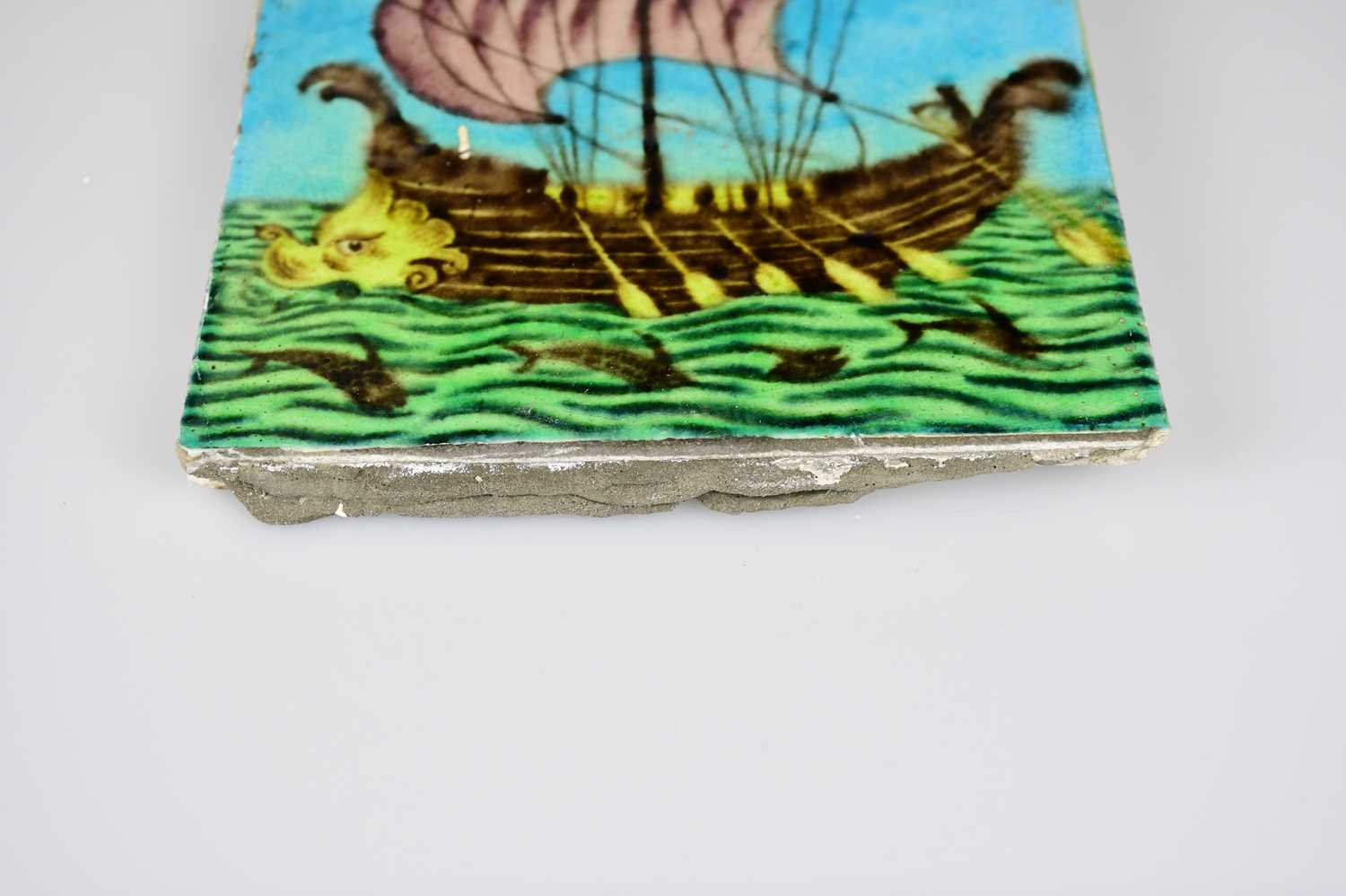 WILLIAM DE MORGAN; an Art Pottery tile painted with a galleon with five sailors, each with paddles - Image 3 of 6