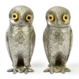 A pair of novelty base metal cruets modelled as owls, heights 8cm.