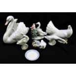 LLADRO; a model of a dove, length 17cm, with a model of swan, number 5231, three geese models, a