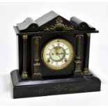 A Victorian black slate eight day mantel clock, with Roman numeral chapter ring and named for