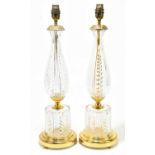 A pair of modern gilt metal and cut glass table lamps, with circular bases, height 50cm (2).