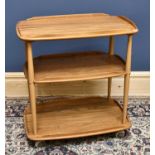 ERCOL; a mid 20th century ash and beech three tier trolley, height 77cm, length 71cm.