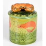 SALLY TUFFIN FOR DENNIS CHINAWORKS; a cylindrical jar and cover with crab finial, decorated with