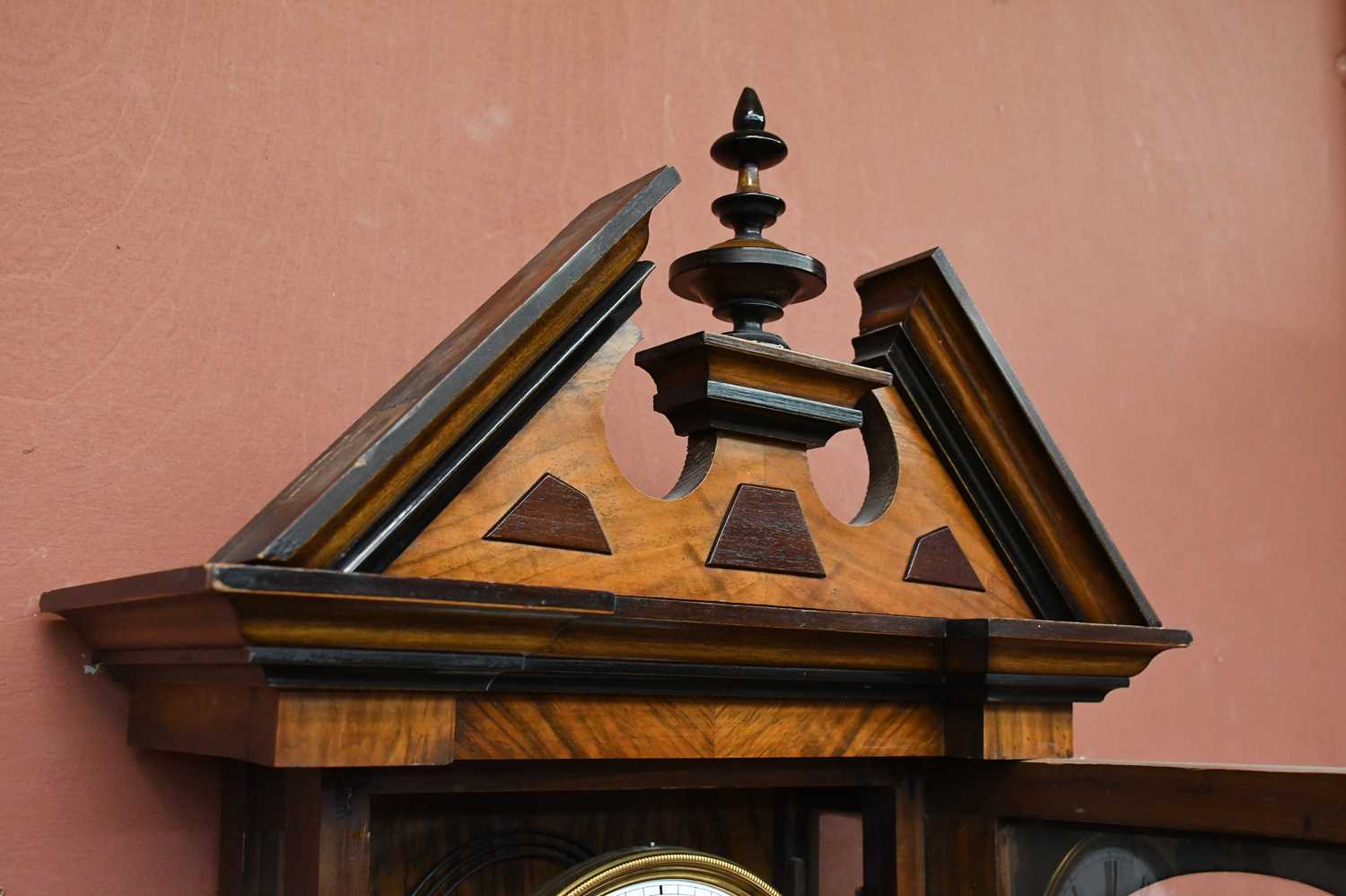 A 19th century walnut and stained pine Vienna wall clock with turned pediment above the circular - Image 4 of 6