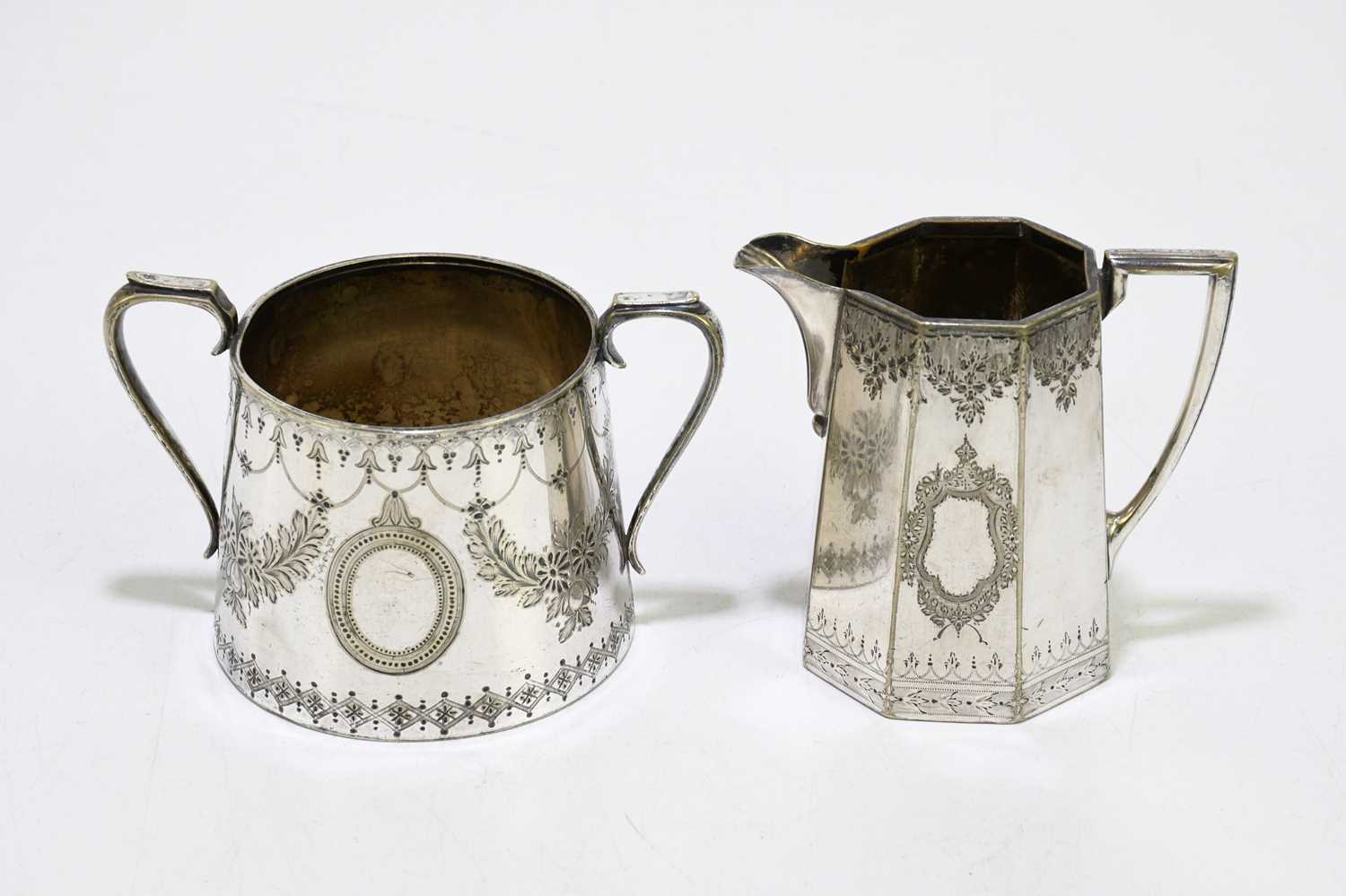 Two silver plated teapots with a sugar bowl, a cream jug and a dish. - Image 4 of 7