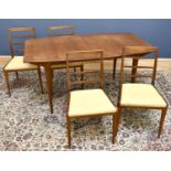 MCINTOSH; a teak mid century dining table and chairs, the shaped rectagular extending dining table