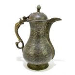 A 19th century Persian metal ewer, with foliate detailing and serpent handle, height 23cm.