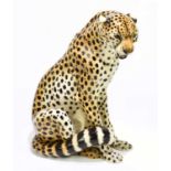 An Italian faience model of a seated cheetah, height 45cm.Condition Report: Good condition.