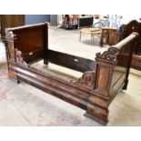 A 19th century mahogany French day bed, height 110cm, length 217cm, width 114cm.