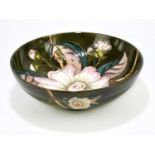 MOORCROFT; a footed bowl in the 'Gustavia Augusta' pattern, diameter 26cm.Condition Report: Good