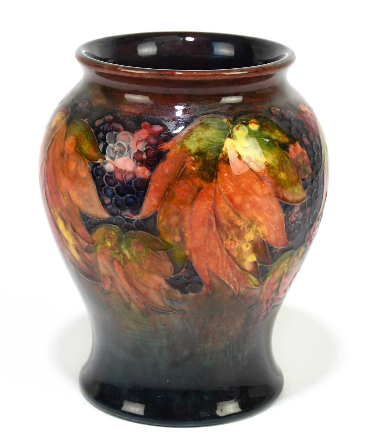 MOORCROFT; a 'Leaf and Berry' pattern flambe vase, impressed marks and painted Walter Moorcroft