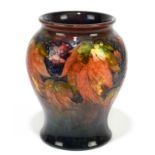 MOORCROFT; a 'Leaf and Berry' pattern flambe vase, impressed marks and painted Walter Moorcroft