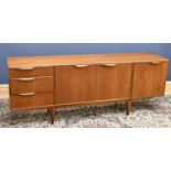 MCINTOSH; a mid century teak sideboard with an arrangement of two cupboard doors flanked to the left