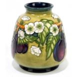 DEBBIE HANCOCK FOR MOORCROFT; a squat vase decorated with fruit on a green ground, impressed marks