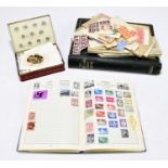 A collection of predominantly British stamps, contained in an album and loose, together with a tin