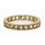 A 9ct yellow gold and white stone set full eternity ring, size K 1/2, approx. 2.1g.