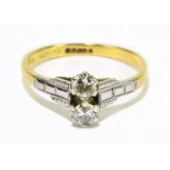 An 18ct yellow gold and twin stone diamond ring, each round brilliant cut stone weighing approx. 0.