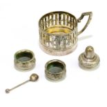A German 830 standard silver pierced cup holder, height including handle 6cm, with a white metal