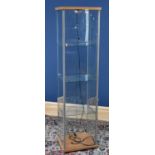 A modern IKEA display cabinet with three glass shelves, height 164cm.