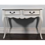 A modern white painted side table with two single drawers, shaped apron on cabriole supports, 75 x