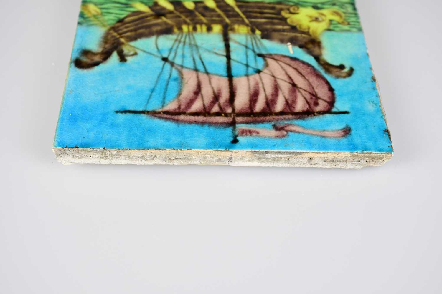 WILLIAM DE MORGAN; an Art Pottery tile painted with a galleon with five sailors, each with paddles - Image 5 of 6