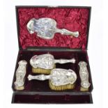 WILLIAM NEALE; an Edward VII hallmarked silver five piece dressing table set in the Art Nouveau