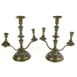 A pair of 19th century Continental pewter candelabra, each with central turned and knopped dish
