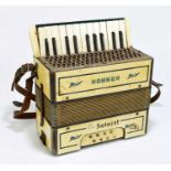 A small Hohner 'The Soloist' piano accordion.