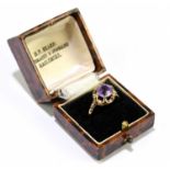 A 9ct gold ring, set with an amethyst type coloured stone, size O, weight 2g.