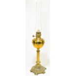 A late 19th century cast brass oil lamp, height 46cm.