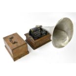 KOH-I-NOOR PHONOGRAPH; with oak case and white metal horn, length 23cm.