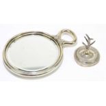 A sterling silver hand mirror, repoussé decorated with floral sprays, width 18.5cm, together with
