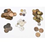 A group lot of assorted coins to include Victorian pennies, farthings, threepences, etc.
