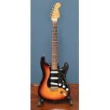 FENDER; a Stevie Ray Vaughan Signature Stratocaster in burnt orange, with Texas special pick ups,