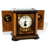 JAEGER LECOULTRE; a fine gilt brass and burr wood Atmos clock, the circular dial with Roman