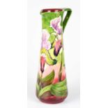 PHILIP GIBSON FOR MOORCROFT; a limited edition ewer, decorated with orchids, numbered 20/250, height