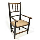 A 19th century child's rush seated elbow chair.