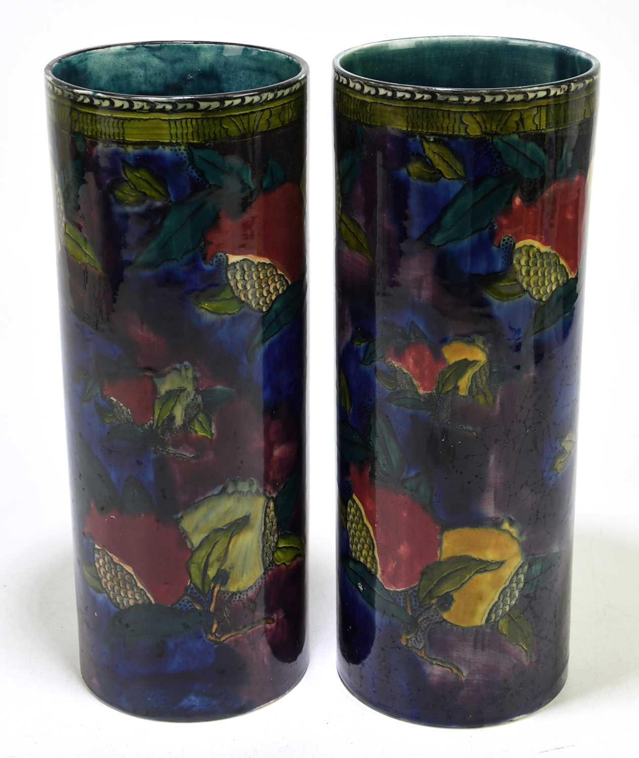 HANCOCK & SONS; a pair of 'Pomegranate' pattern cylindrical sleeve vases, height 32cm.