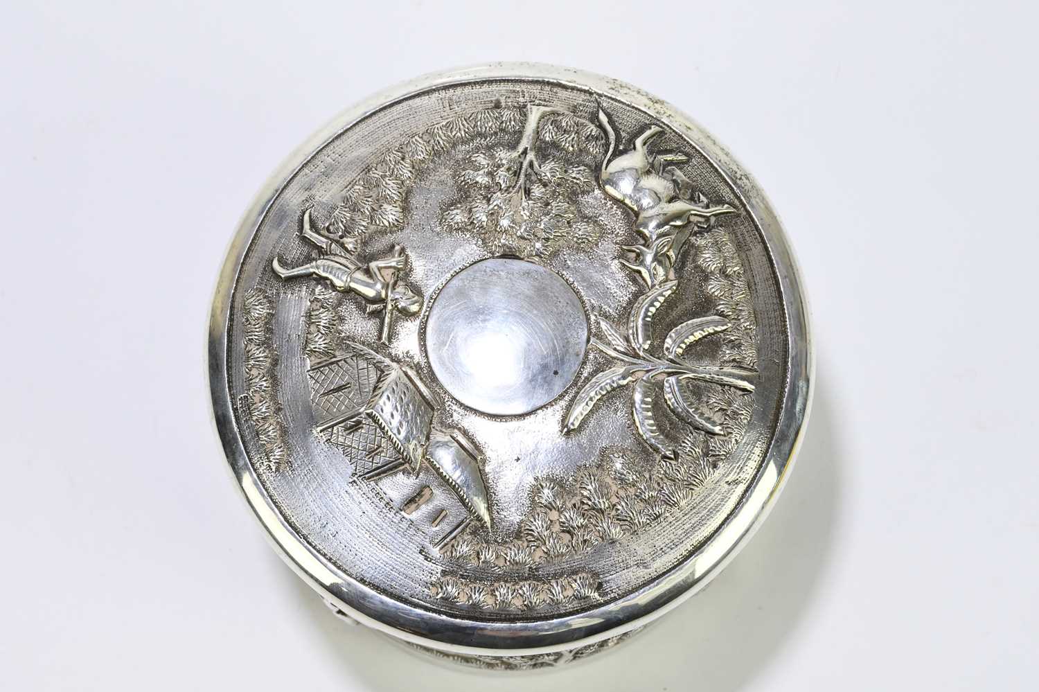 An Indian white metal lidded trinket box, decorated with village scenes. - Image 4 of 5