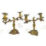 A pair of 19th century cast and gilt metal twin branch candelabra, of Rococo design, height 36cm (