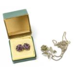 A pair of amethyst set earrings, stamped silver, together with a white metal chain with flower