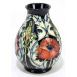 RACHEL BISHOP FOR MOORCROFT; a baluster shaped vase decorated in the 'Poppy' pattern, impressed