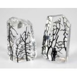 BACCARAT; two contemporary clear glass paperweights with woodland effect decoration, height 7.5cm (