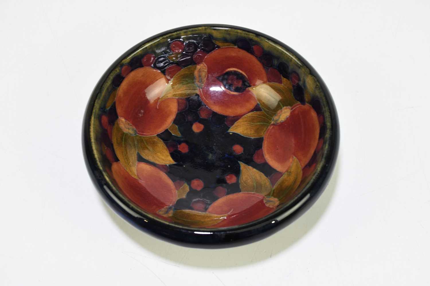 MOORCROFT; a 'Pomegranate' pattern bowl, with shaped rim, impressed marks and painted William - Image 2 of 3