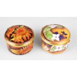 AMANDA ROSE FOR MOORCROFT; an enamel circular trinket box and cover decorated in the 'Sunflower'