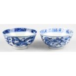 Two 19th century Chinese blue and white porcelain footed bowls each decorated with a four claw