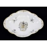 A Chinese armorial porcelain lobed dish, the centre decorated with a crowned armorial, length 14.